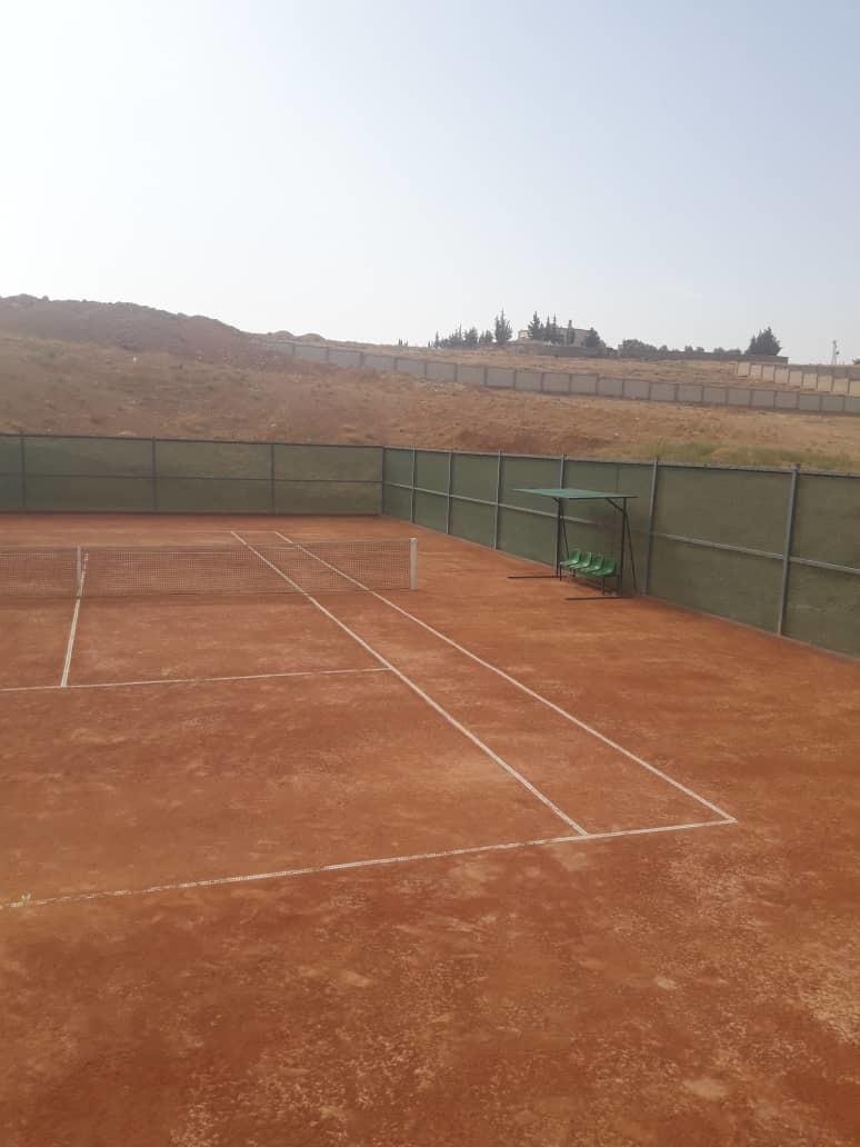 Al Saboura outdoor clay tennis court