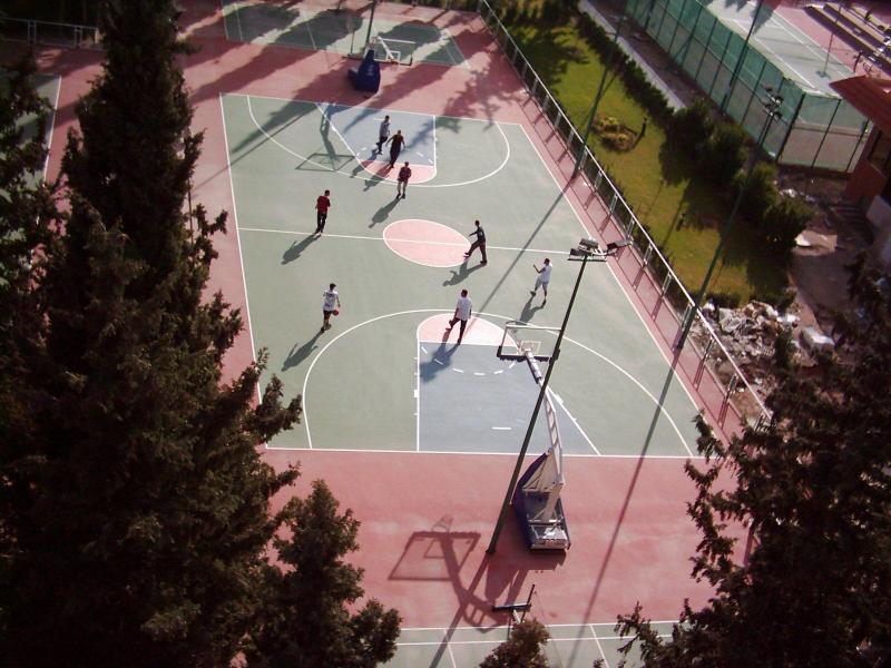 Elevated view of outdoor basketball court in use