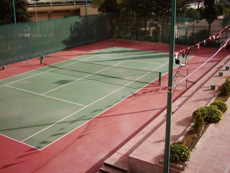 Professional red and green outdoor tennis court